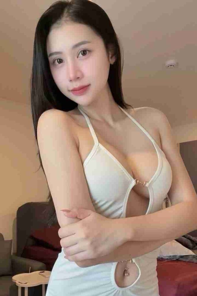 KL Escort Girl Attractive Asian woman in a white dress. Malaysia Sex Call Girl
