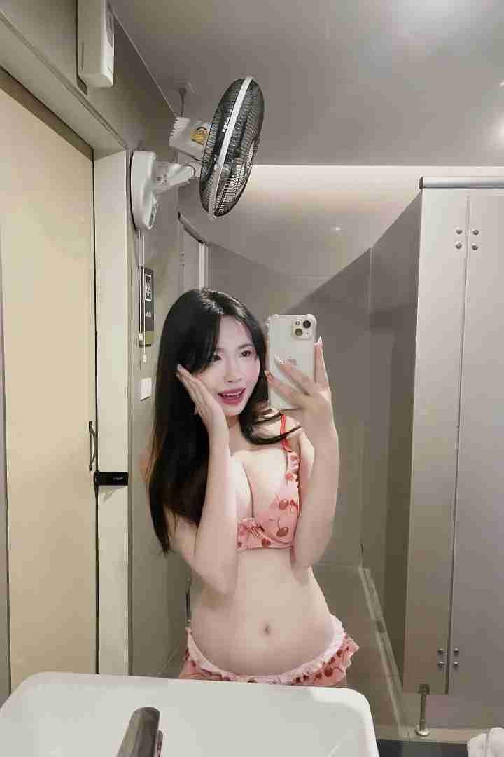 KL Escort Girl Woman in cherry print lingerie takes a selfie in a bathroom. Malaysia Sex Call Girl