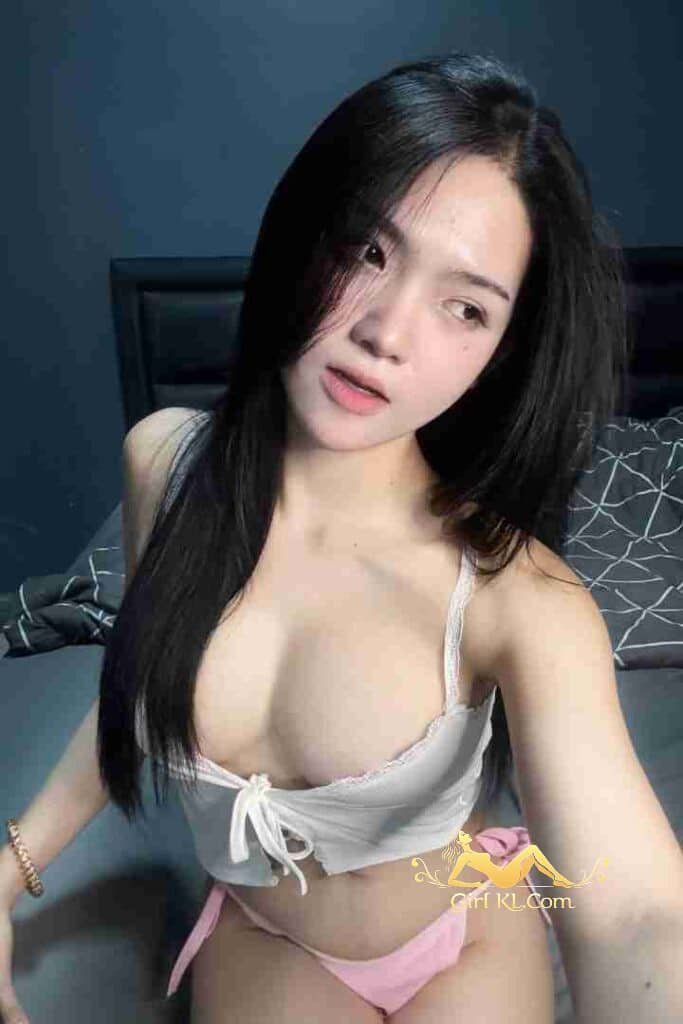 Beautiful Asian woman in lingerie on bed. KL Escort. B Cup. 49kg. 164cm.