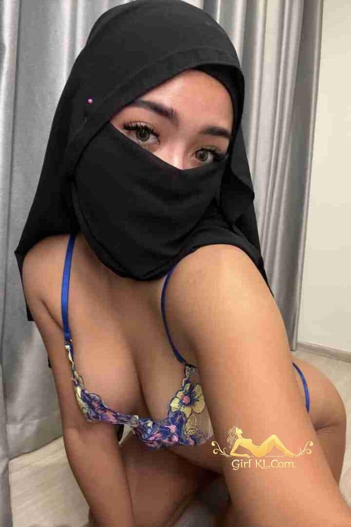 Malay woman in hijab and lingerie. KL escort. Playful Nairah.