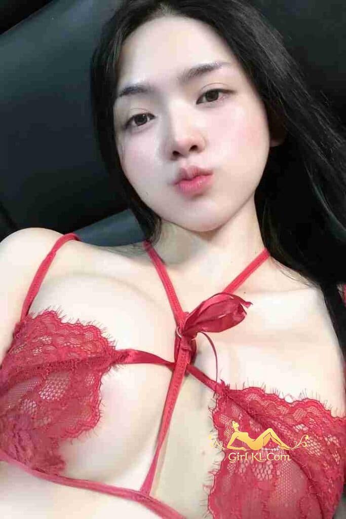 Thai woman in red lingerie. B cup, 49kg, 164cm. KL Escort incall/outcall.