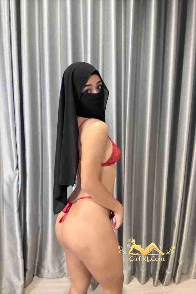 Woman in lingerie and niqab veil. Petite Nairah escort in KL.